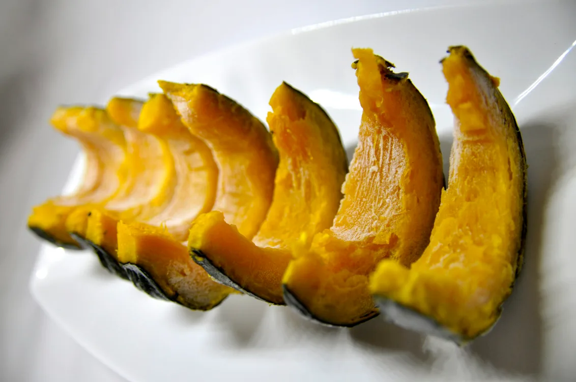 A plate of dark, caramelized roasted squash slices