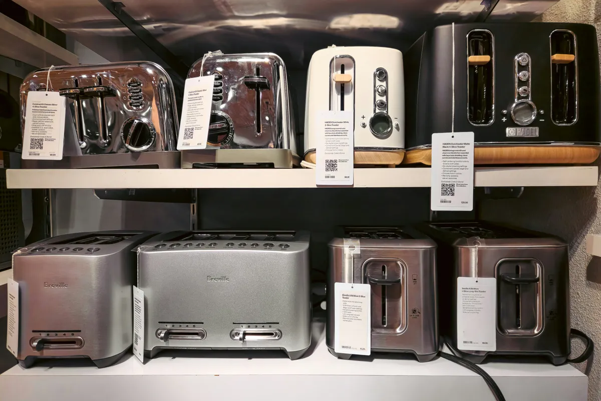 A wall of small kitchen appliances in every size and finish