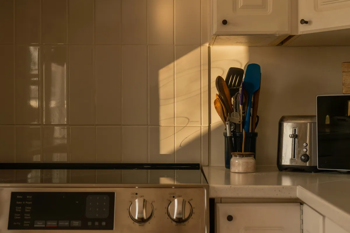 A kitchen counter at dusk with the appliances that draw the power